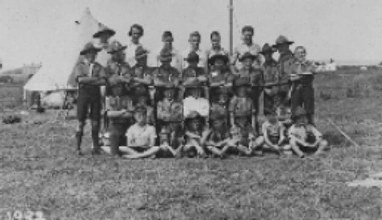 An early-1920s black-and-white photograph of 2nd Otley Scouts posed at camp beside their tent