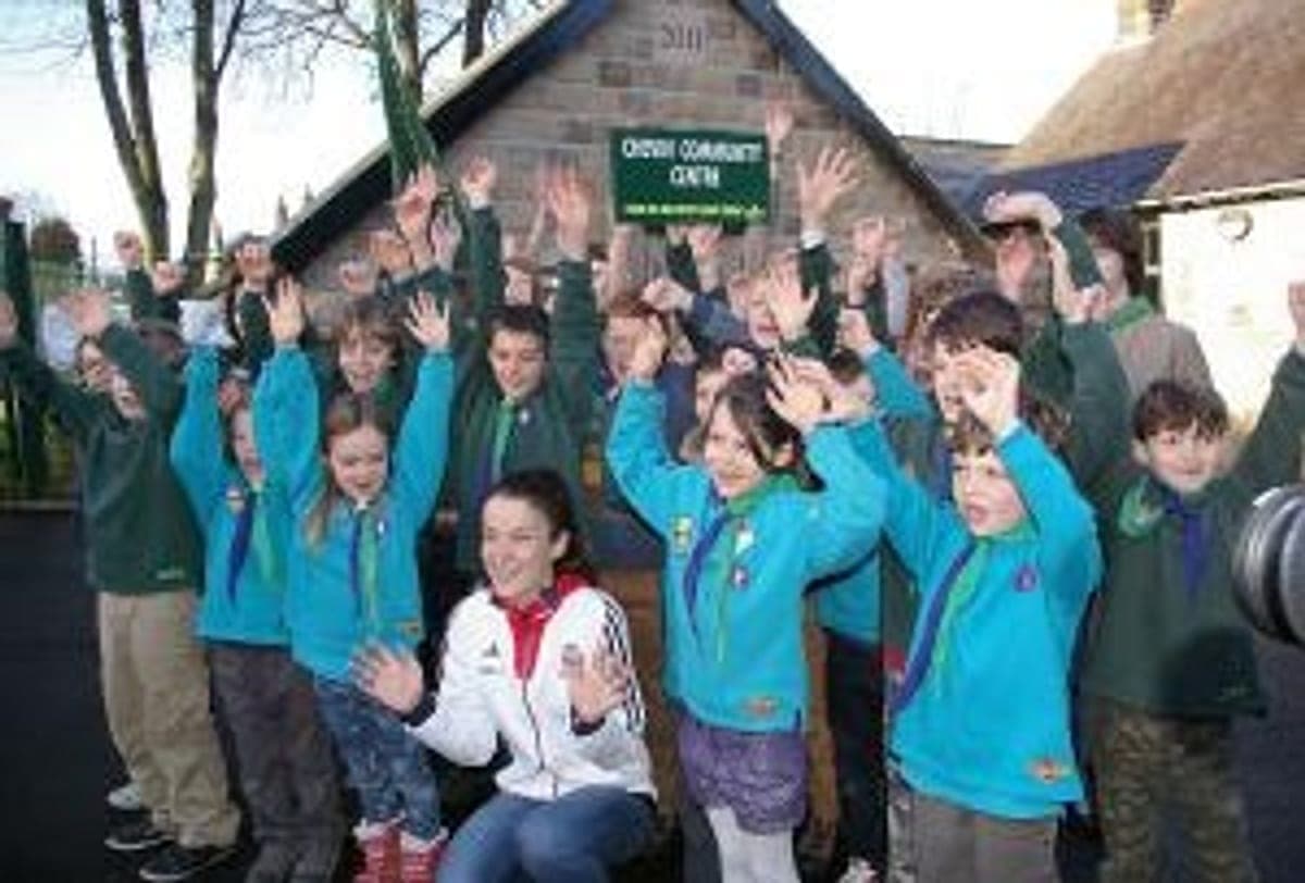 Group members waving outside the extended Chevin Community Centre