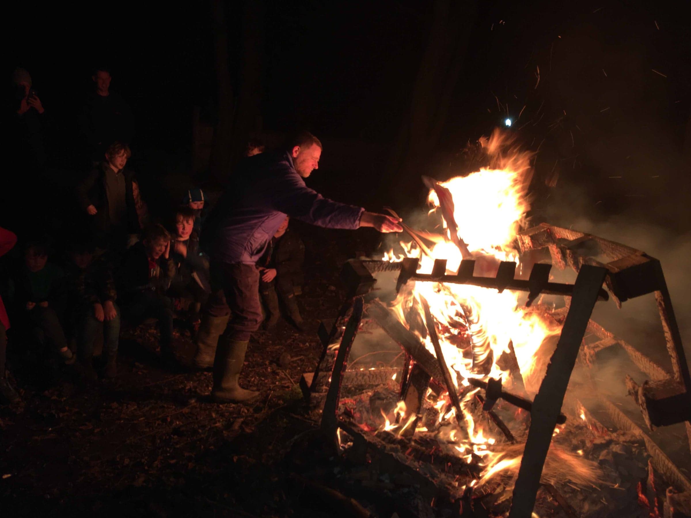 Gathered around the campfire at Scout camp.