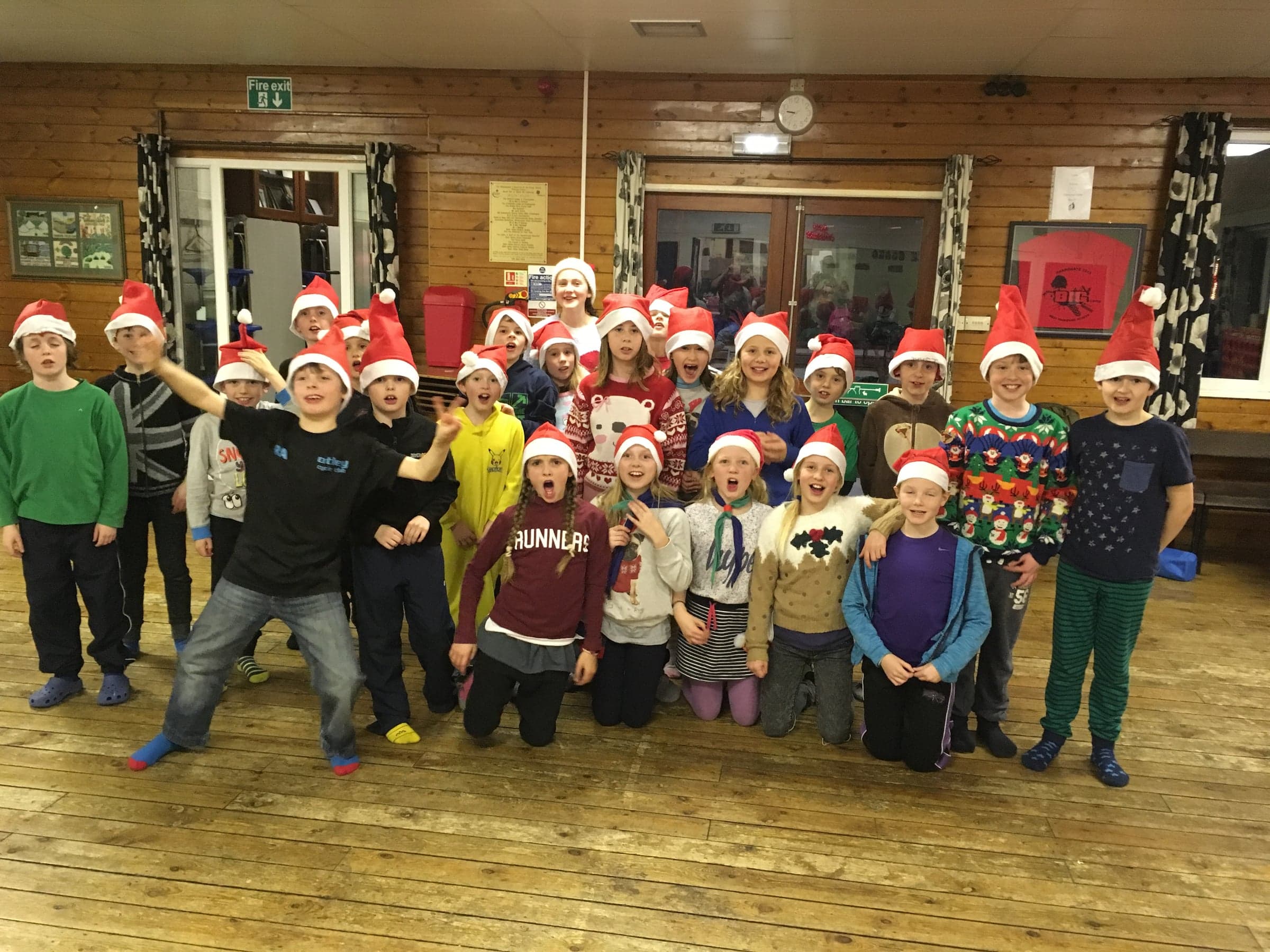 The whole group together in the hall.