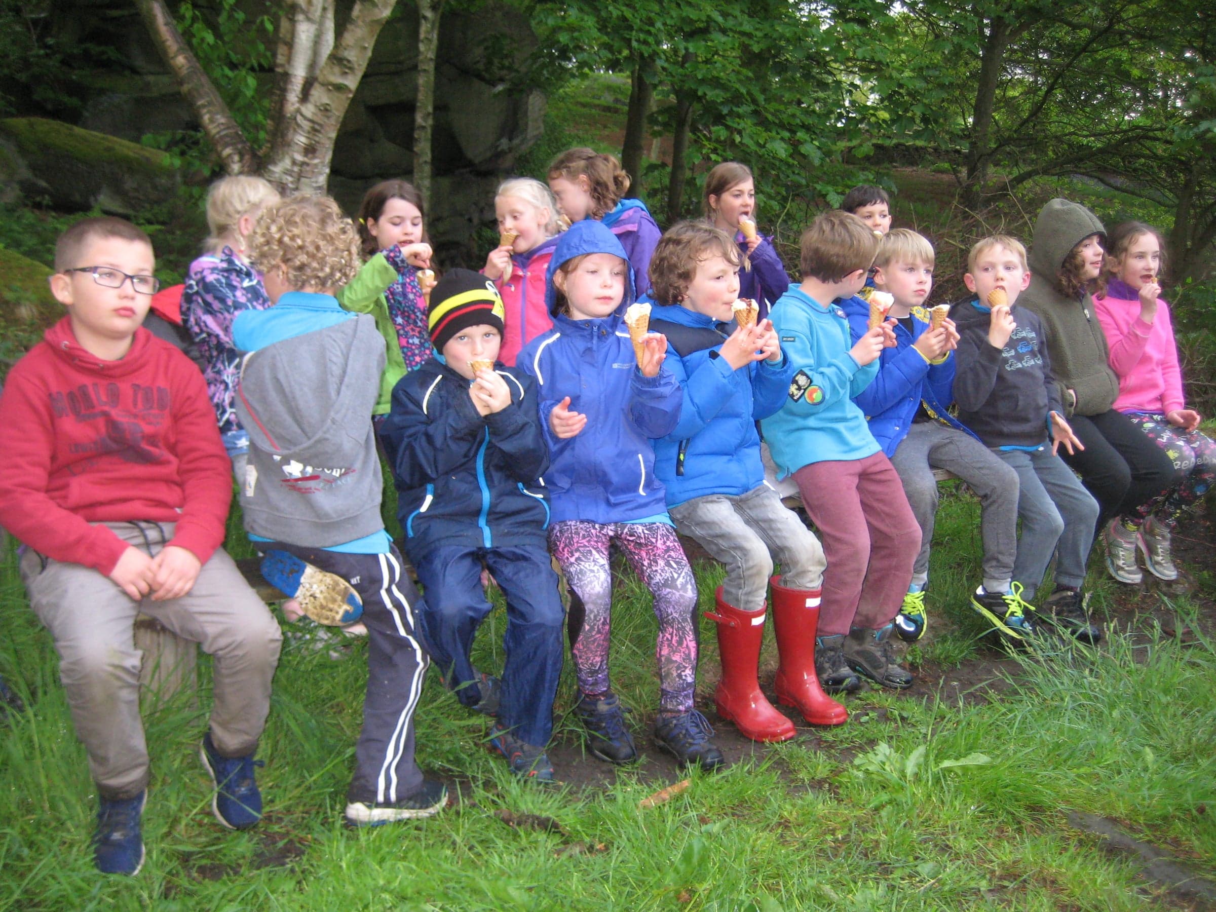 A muddy-booted group shot at camp.