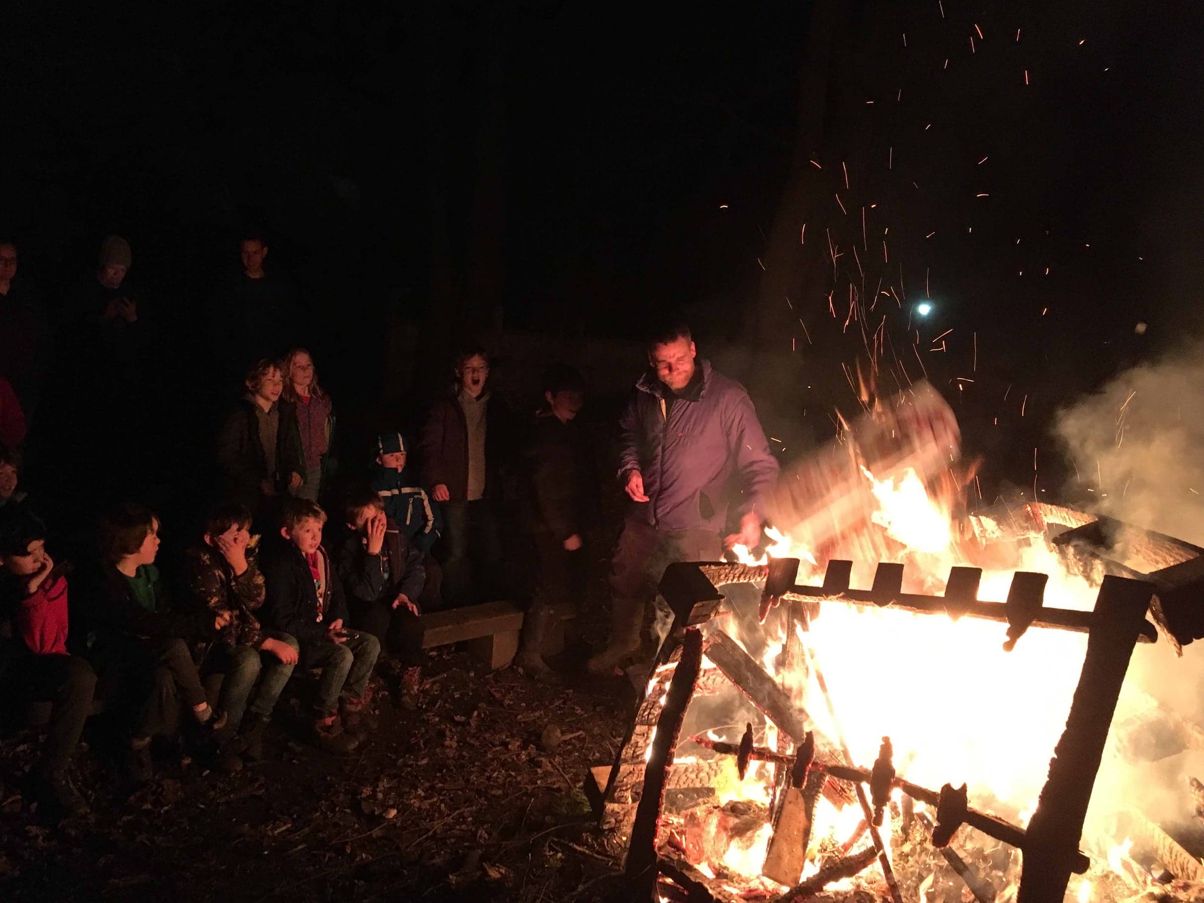 The Viking long boat burns after dark at Cub Camp, 2017.