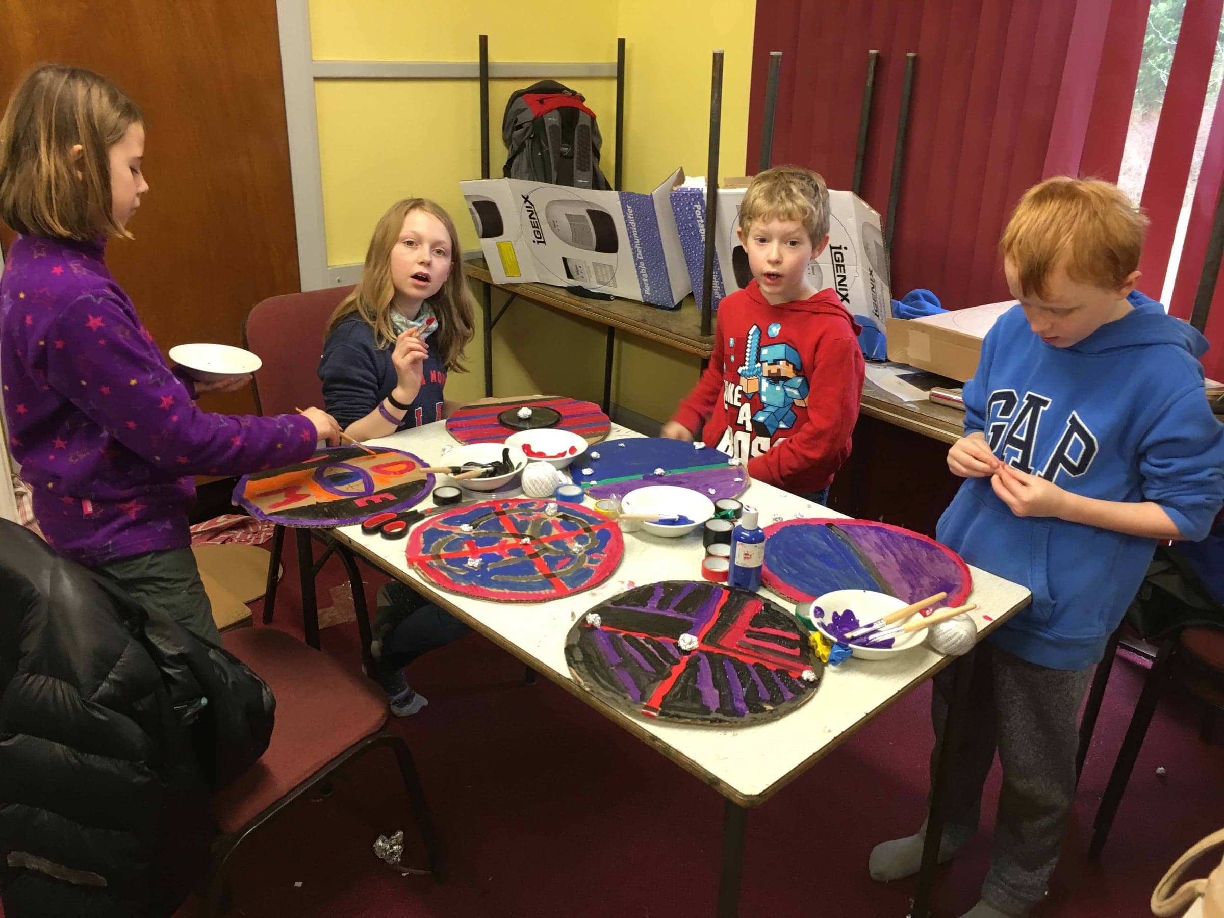 Painting Viking shields at Cub Camp.
